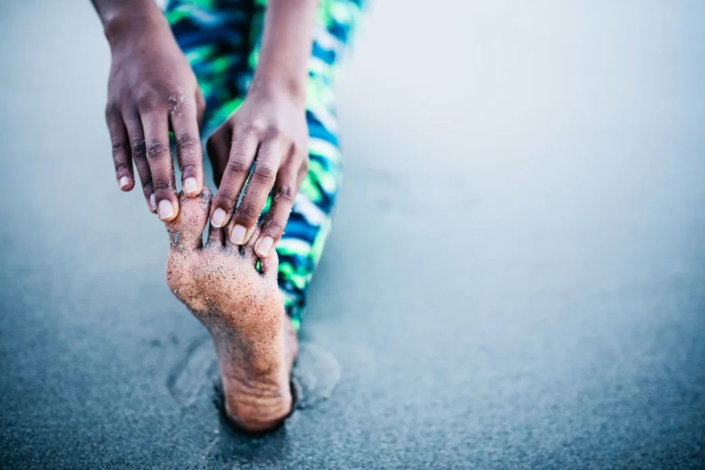 close up of woman stretching her leg after workout 2023 11 27 05 28 10 utc