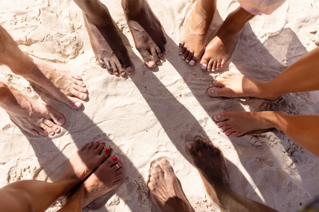 close up of diverse friends feet at beach 2023 11 27 04 55 31 utc